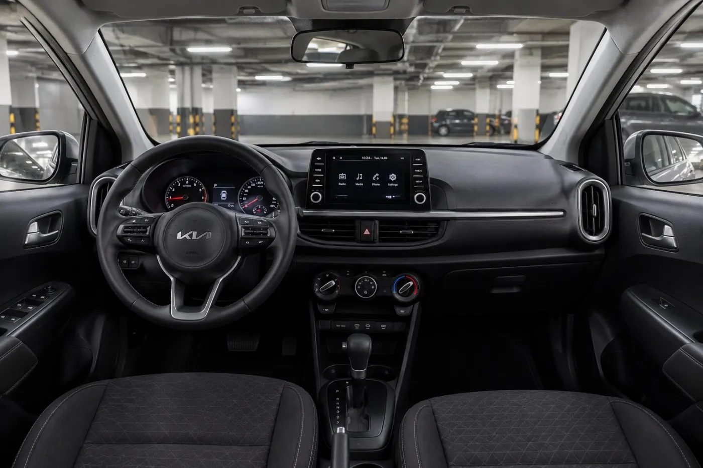 Kia Picanto parked in a modern parking garage